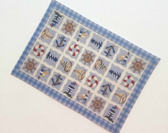 May include: A blue and white checkered rug with a nautical theme. The rug features a variety of nautical symbols, including anchors, lighthouses, ships, and steering wheels.