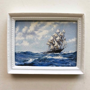 White Framed Nautical Miniature of Vintage Sailing Ship at Sea Printed on Canvas