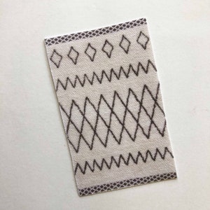 Miniature Light Colored Moroccan Style Rectangular Rug in Several Scale Sizes.