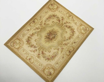May include: A beige and brown patterned rug with a floral design. The rug has a square shape and a woven texture.