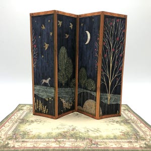 May include: A wooden folding screen with four panels depicting a night scene with trees, a crescent moon, birds, and a white horse. The screen is decorated with a dark blue background and gold accents.