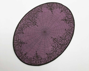 May include: A purple oval rug with a black lace design around the edge.