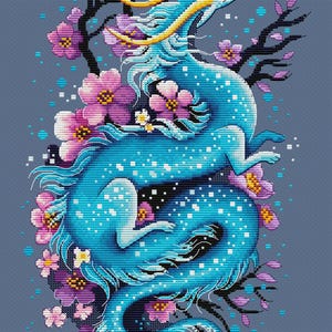 May include: A cross-stitch design featuring a blue dragon with yellow details, framed by pink and purple flowers and dark branches. The dragon is set against a grey background. The artist's name, Nadezhda Gavrilenkova, is in the bottom right corner.