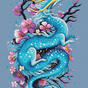 May include: A cross-stitch design featuring a blue dragon with yellow details, encircled by pink and purple flowers and black branches, on a light blue backdrop. The dragon is depicted in a dynamic pose, with a detailed, pixelated appearance.