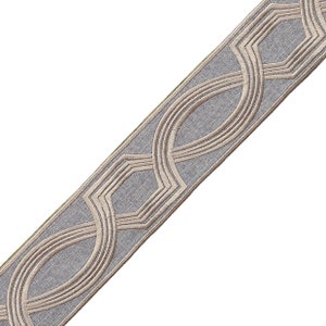 May include: A gray and beige trim with a geometric pattern. The trim features a repeating design of interlocking circles and hexagons.