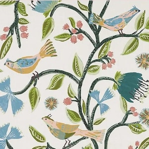 May include: A fabric pattern featuring light blue and tan birds perched on dark green branches with green leaves, pink berries, and large blue flowers. The design is set against a white background, showcasing a repeating botanical illustration.