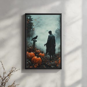 May include: A framed Halloween-themed artwork depicts a spooky scene with a figure in a dark cloak, pumpkins, and a crow perched on a weathered post. The artwork has a dark, atmospheric color palette with orange, black, and gray tones.