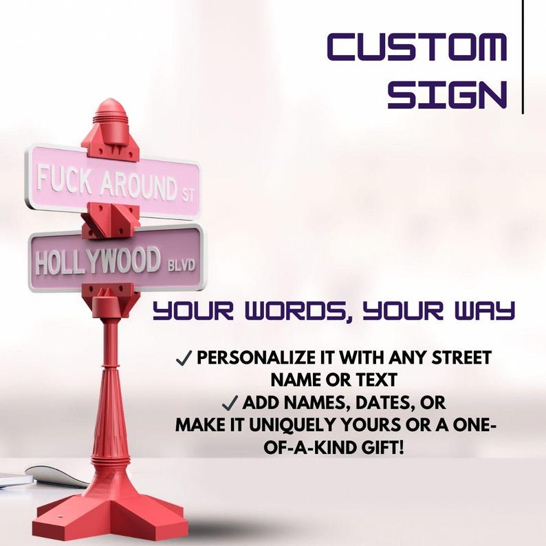 May include: A red custom sign with two pink street signs that read "FUCK AROUND ST" and "HOLLYWOOD BLVD". The sign also includes the text "CUSTOM SIGN" and "YOUR WORDS, YOUR WAY".
