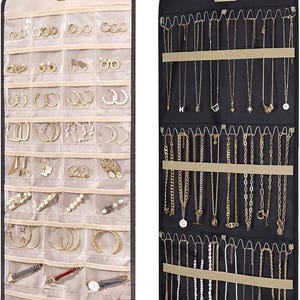 May include: Two hanging jewelry organizers. One is beige with clear pockets holding earrings, bracelets, and rings. The other is black, displaying necklaces of varying lengths and styles. Both have metal hooks.