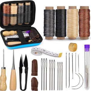 May include: A sewing kit with various tools and supplies. Includes spools of thread in multiple colors, needles, scissors, a thimble, a measuring tape, and a needle threader. The kit is in a blue zippered case.