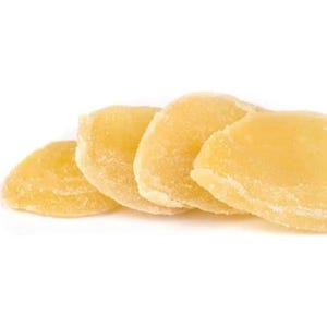 May include: A close-up of several slices of candied ginger, arranged in a row. The ginger slices are a light yellow color and have a slightly crystallized surface. The background is plain white.