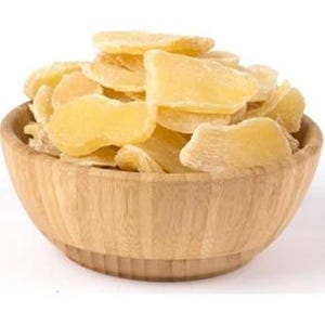 May include: A wooden bowl filled with dried ginger slices. The ginger has a light yellow color and a slightly translucent appearance. The bowl is made of light-colored wood and has a simple, natural design. The background is plain white.