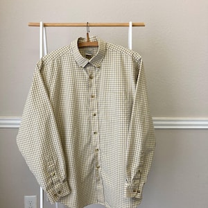 May include: A handmade, wooden serving tray with a natural finish. The tray features a rectangular shape with raised edges and two handles. The wood grain is visible, and the tray appears sturdy. Dimensions are approximately 18 inches long and 12 inches wide.