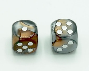 May include: Two six-sided dice with white dots on a black, brown, and silver swirled background.