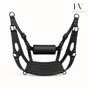 May include: Black leather swing with a curved seat and a padded bolster. The swing has adjustable straps with buckles and metal rings for hanging. The design includes cut-out details on the side supports. The text "FV HIDE VOGUE" is in the upper right corner.