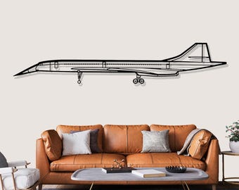 May include: A black metal wall art piece of the Concorde supersonic jet. The artwork is a detailed outline of the aircraft, showing its delta wings and elongated fuselage. The piece is mounted on a neutral wall above a brown leather sofa, a classic design.