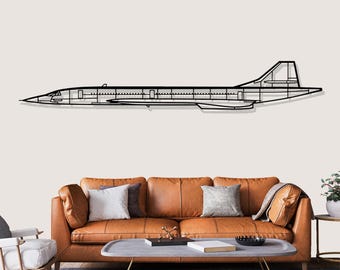 May include: A black metal wall art piece showing the outline of a Concorde aircraft. It's mounted on a light wall above a brown leather sofa with cushions. The design of the plane is minimalist and modern.