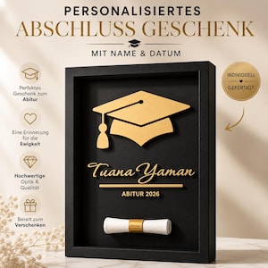Peut inclure: Un cadeau de remise de diplôme personnalisé dans un cadre noir. Le design présente un mortier doré, le nom "Tuana Yaman" et "ABITUR 2026". Un diplôme roulé avec une bande dorée est en bas. Le texte dit "Cadeau de remise de diplôme personnalisé".