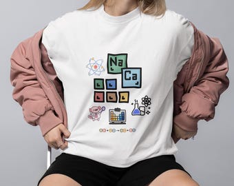 Camiseta de elementos científicos / Bloques de la tabla periódica, átomos e iconos de laboratorio