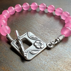 BARBIE LOVES PINK. stone bracelet. hot pink candy jade. Sundance style. bold color. antiqued silver flower toggle clasp. fun gift for her.