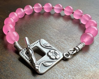 BARBIE LOVES PINK. stone bracelet. hot pink candy jade. Sundance style. bold color. antiqued silver flower toggle clasp. fun gift for her.