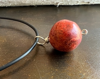 BIG RED. red sponge coral pendant. charm. key fob. nice fossil markings. hand-wrapped sterling silver bail. Sundance style.