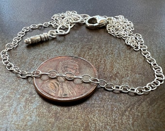 SWEET. 925 sterling silver chain necklace. small links. secure lobster clasp. will fit through 7mm pendant bail.