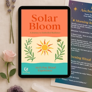 May include: A digital tablet displays the cover of "Solar Bloom: A Journey to Embodied Radiance." The cover features orange text and a sun illustration. The image includes flowers, crystals, and a printed guide with ritual instructions.