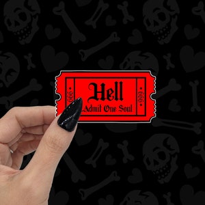 May include: Red ticket with the text "Hell Admit One Soul" and the number 666 on each side. The ticket is being held by a hand with black nail polish.