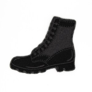 May include: Black embroidered boot patch. The boot has a lace-up design and a thick sole.
