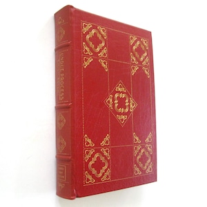 May include: A red hardcover book with gold decorative patterns and the title "Due Process" on the spine. The cover features a grid design with ornate gold embellishments. The book is set against a white background.