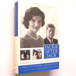 May include: A hardcover book titled "Jackie After Jack: Portrait of the Lady" by Christopher Andersen. The cover features a black and white portrait of Jacqueline Kennedy and John F. Kennedy. The spine is blue with white text.
