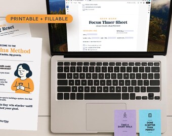 May include: A laptop displays a "Focus Timer Sheet" with "Printable + Fillable" text. The image includes a smartphone, earbuds, and cards with text. The text "Daily Focus Toolkit" is visible, along with a plant and a pen.