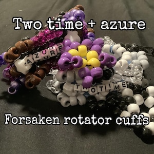 May include: A collection of colorful beaded bracelets. The bracelets feature various colors, including purple, brown, white, black, and yellow. Some beads spell out "AZURE" and "TWO TIME". The text "Forsaken rotator cuffs" is also present.