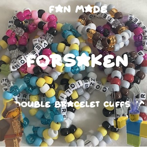 May include: A collection of colorful beaded double bracelet cuffs. The bracelets feature various colors including pink, blue, yellow, and white. Some beads spell out words like "FORSAKEN" and "DOUBLE BRACELET CUFFS".