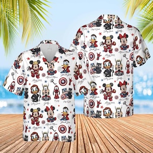 May include: White button-down shirt featuring a repeating pattern of Disney characters in superhero costumes. The design includes Mickey Mouse, Minnie Mouse, Donald Duck, and Goofy, along with stars and superhero symbols. The shirt has a classic collar and short sleeves.