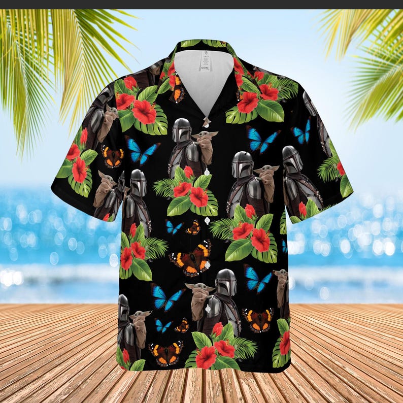 May include: Black Hawaiian shirt featuring a repeating pattern of The Mandalorian, Grogu, red hibiscus flowers, blue butterflies, and brown butterflies. The shirt has a classic collar and short sleeves, perfect for a tropical vacation.
