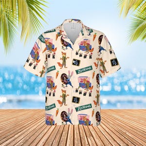 May include: Cream-colored button-down shirt with a repeating pattern of characters and imagery from the animated film "Zootopia." The design includes foxes, bunnies, carrots, and the film's logo. The shirt has short sleeves and a classic collar.