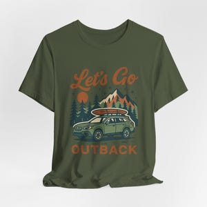 Retro Let’s Go Outback graphic t-shirt with Subaru style SUV, vintage camping adventure print, cozy boho outdoors road trip design