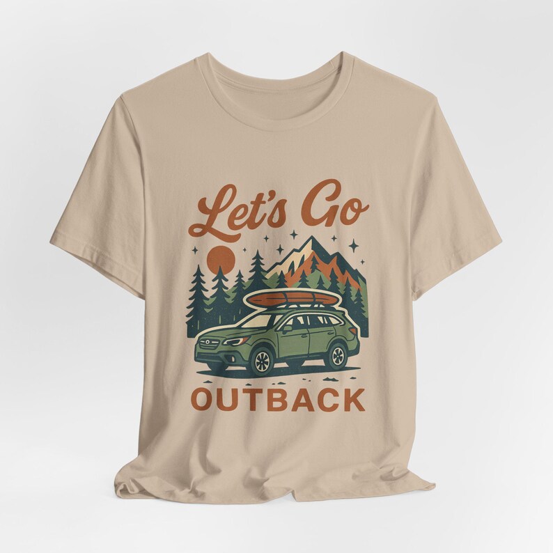 Retro adventure tee with Let’s Go Outback design, Subaru inspired SUV, camping scene, and boho outdoors graphic shirt for car enthusiasts