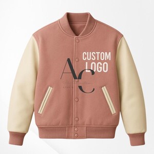 May include: A coral-coloured varsity jacket with cream-coloured sleeves. The jacket has a ribbed collar, cuffs, and hem, with a button-up front and two front pockets. The text "CUSTOM LOGO" is printed on the chest.
