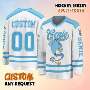 May include: White hockey jersey with light blue accents. The jersey features the word "Genie" in a script font, a cartoon genie illustration, and the text "HOCKEY JERSEY ADULT/YOUTH". The back of the jersey has the word "CUSTOM" and the number "00".