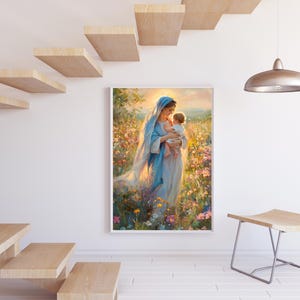 May include: A framed painting depicts a woman in a blue robe holding a baby in a field of flowers. The artwork has a soft, painterly style with warm, golden light. The painting is displayed on a white wall near a wooden staircase and a modern stool.