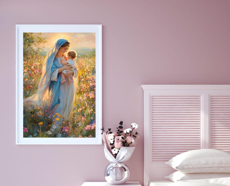 May include: A framed print depicts a woman in a blue veil holding a baby in a field of flowers. The artwork has a soft, ethereal quality with warm lighting. The color palette includes blues, yellows, and pinks, creating a serene and gentle scene.