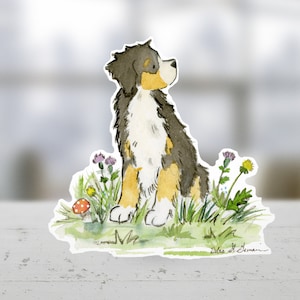 May include: Watercolor illustration of a Bernese Mountain Dog sitting in a field of wildflowers. The dog is looking up and has a brown, black, and white coat. The flowers are purple, yellow, and white. There is a red mushroom in the foreground.