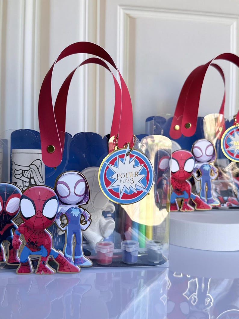 May include: A white ceramic mug with a black handle and the text "But first, coffee" in a handwritten style. The mug is on a white surface. The mug is approximately 4 inches tall.