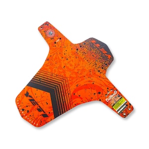 May include: An orange and black bicycle mudguard with a custom design. The mudguard features a textured orange background with black splatter and geometric shapes. The text "Custom D" is visible.