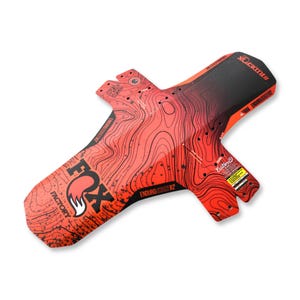 May include: A bicycle mudguard featuring a red and black gradient colour scheme with a topographic map pattern. The accessory displays the Fox Factory logo, the text Enduro Short V2, and the hashtag #RIDEFOX printed in black and white lettering.