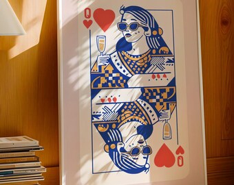 May include: A framed art print of the Queen of Hearts playing card. The illustration features a woman wearing sunglasses, holding a champagne glass, and is rendered in blue, gold, and white. The artwork is displayed in a white frame.