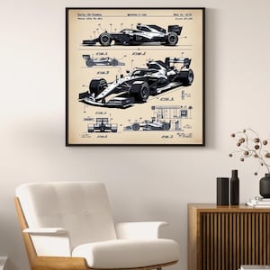 May include: Framed print featuring a black and white illustration of a modern F1 car, with detailed diagrams and technical drawings. The artwork includes text and is displayed in a black frame.